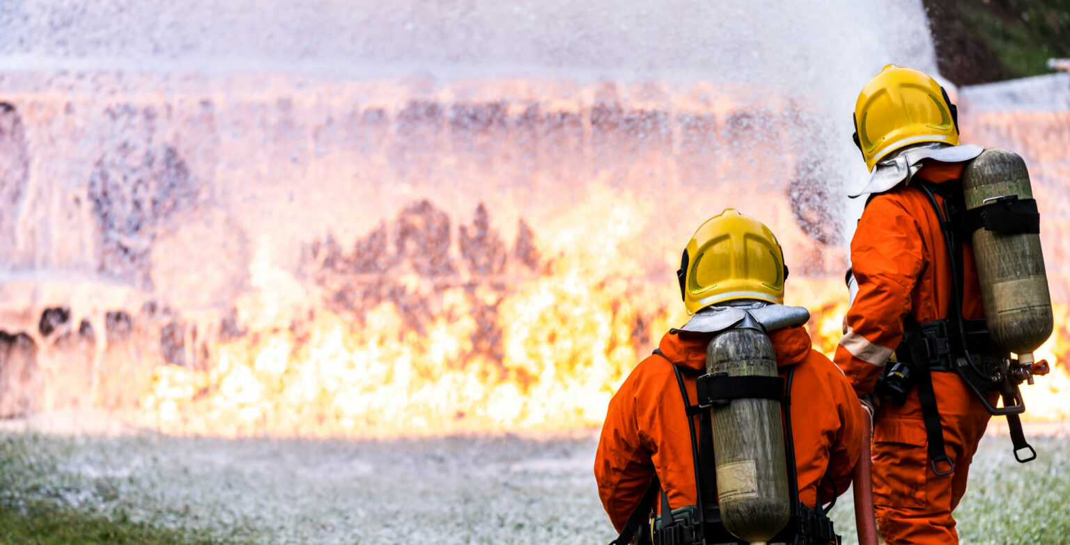 Panoramic,Firefighter,Using,Chemical,Foam,Fire,Extinguisher,To,Fighting,With