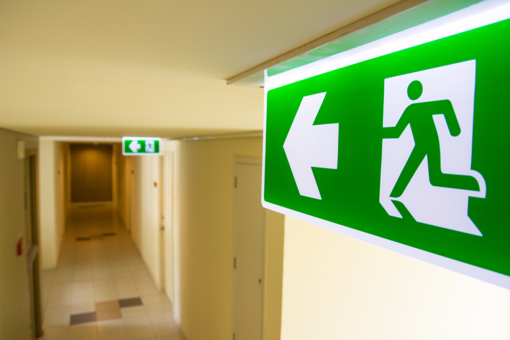 Fire,Exit,Sign,At,The,Corridor,In,Building