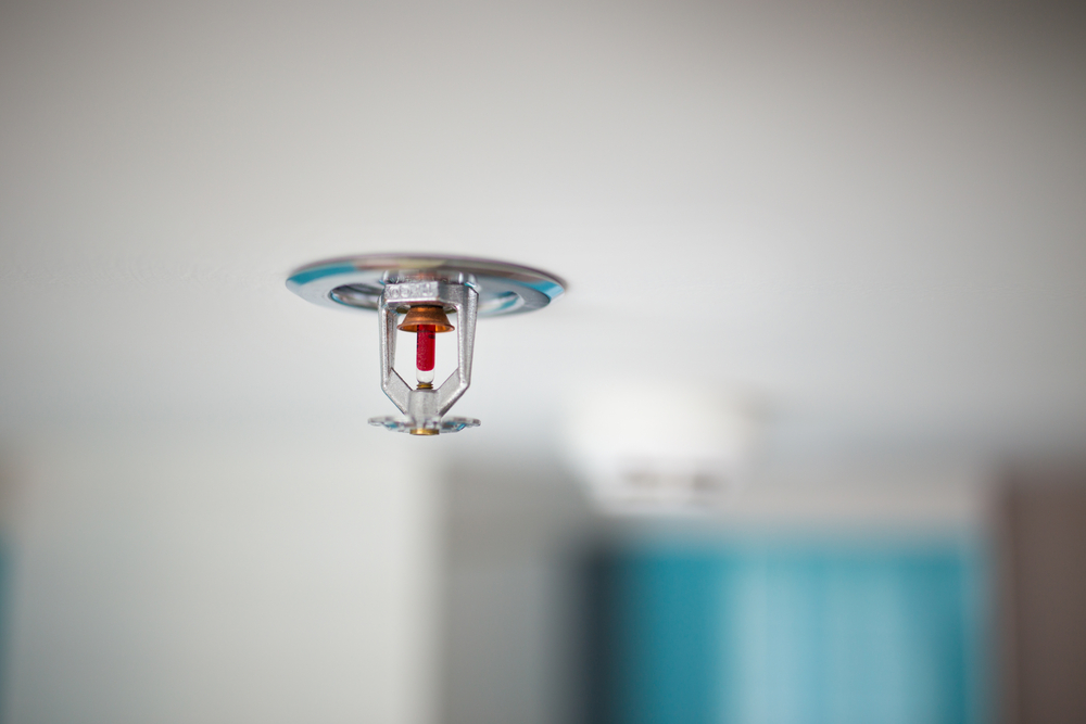AEI Cables is asking for further guidance on the application of new measures which make sprinkler systems mandatory in all new high-rise blocks over 11 metres high.