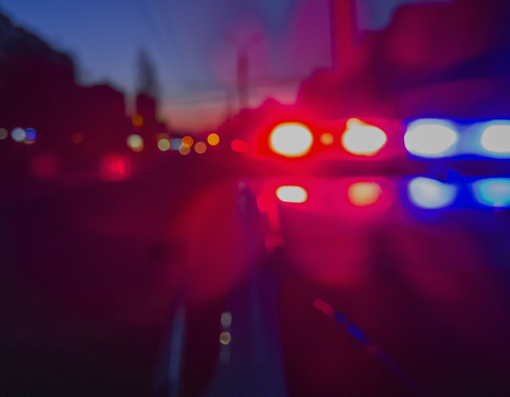 Red,And,Blue,Lights,Of,Police,Car,In,Night,Time.