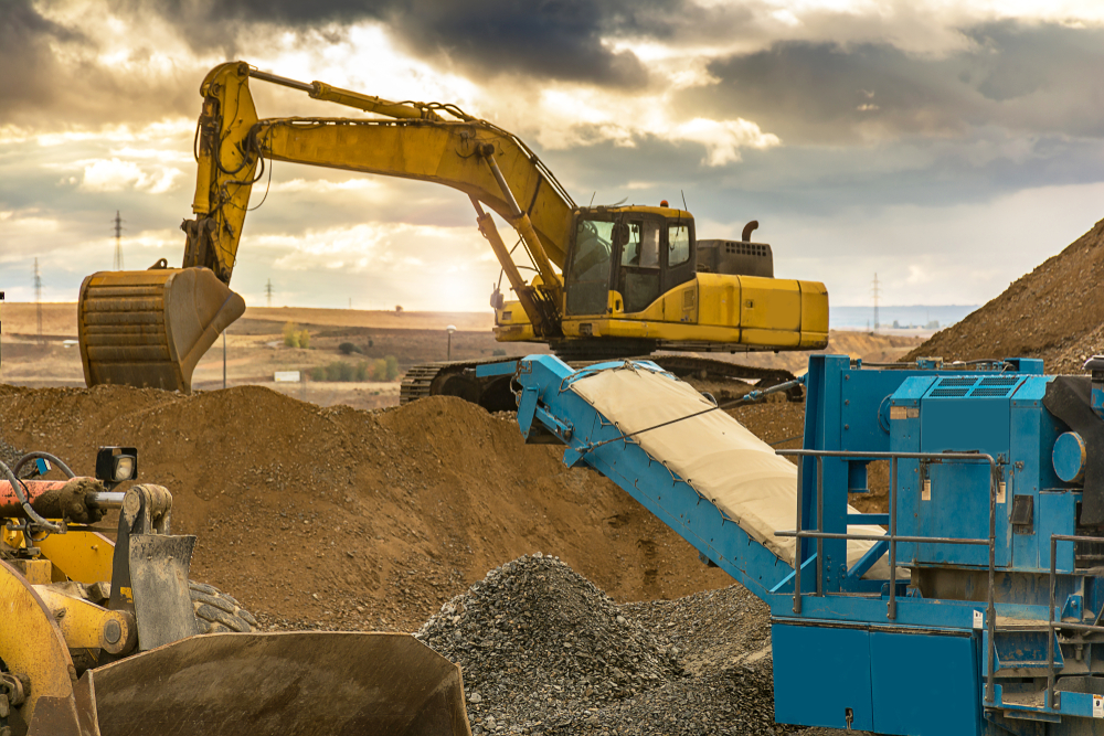 Excavator,And,Stone,Crusher,In,A,Quarry