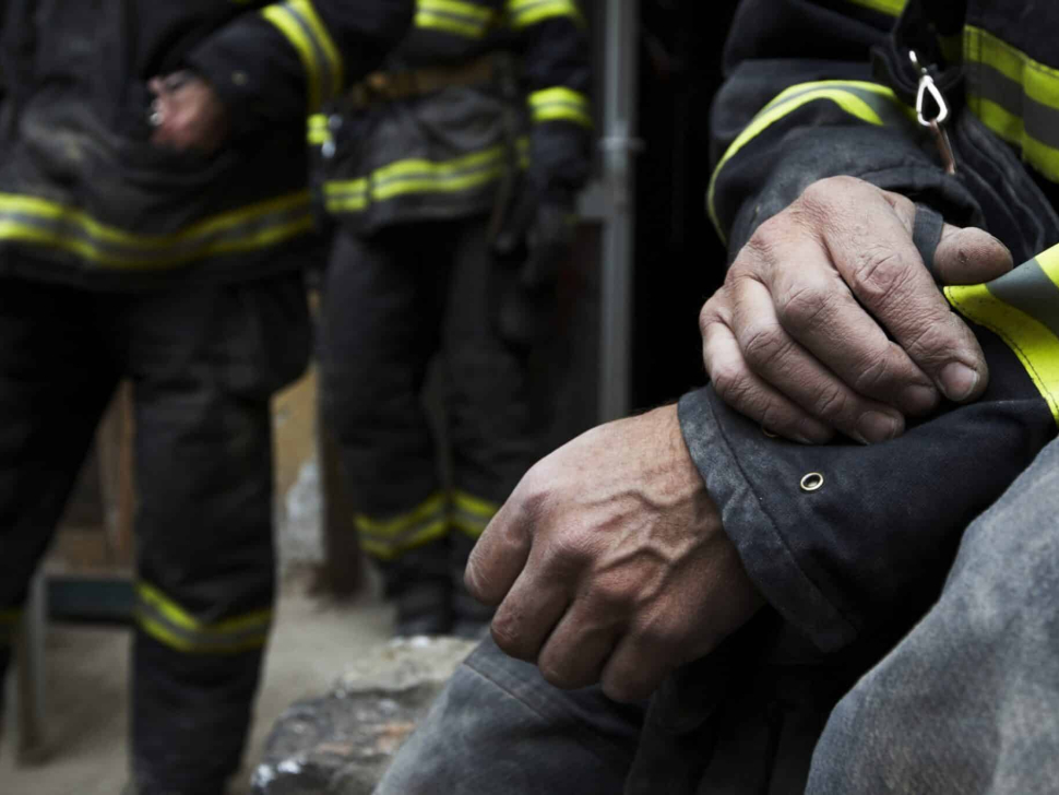 Sadness,And,Hope.,Firefighter,Resting,During,The,Rescue,Work.