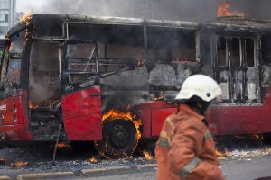Jakarta June 2nd 2012, Fire fighter entering the busway burning scene to stop the fire.