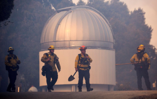 US fire crews fought to defend homes and the famed Mount Wilson Observatory from California’s biggest and most dangerous wildfire.