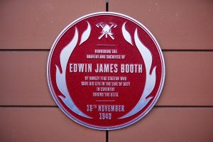 The red plaque unveiling at Hanley fire station, Hanley, Stoke-on-Trent for Edwin james Booth he gave his life in service in the Blitz in 1940, attended by his decedents  Jeff and Su Cotton