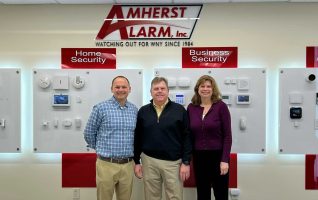 Eric Garner, President of Pye-Barker's Alarm Division, meets with Tim and Maryann Creenan of Amherst Alarm.