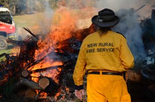 Nsw,Rural,Fire,Service,,With,Backburning,And,Firetruck,In,Background