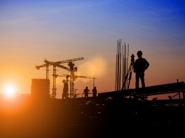 Silhouette,Of,Survey,Engineer,And,Construction,Team,Working,At,Site