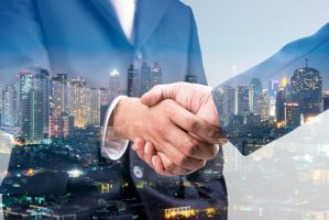 Double,Exposure,Of,Business,Handshake,For,Successful,Of,Investment,Deal