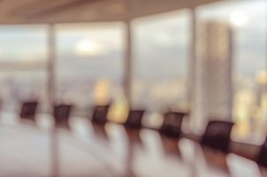 Blur,Image,Of,Empty,Boardroom,With,Window,Cityscape,Background.,Business