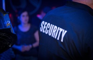 Back,Of,A,Bouncer,(security,Guard),In,A,Nightclub,During