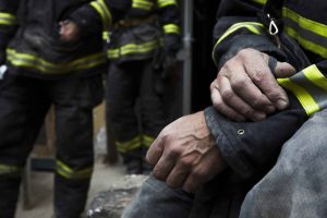 Sadness,And,Hope.,Firefighter,Resting,During,The,Rescue,Work.